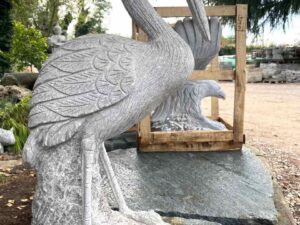 Granite heron sculpture with stone handmade bird on offer from garden furniture stock warehouse Pietrarredo price